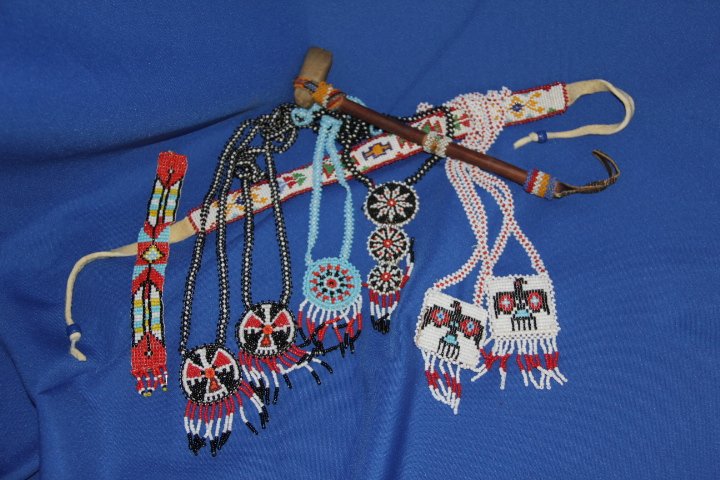 Indian Beaded Items: Hatchet, 2 bracelets and 6 necklaces.