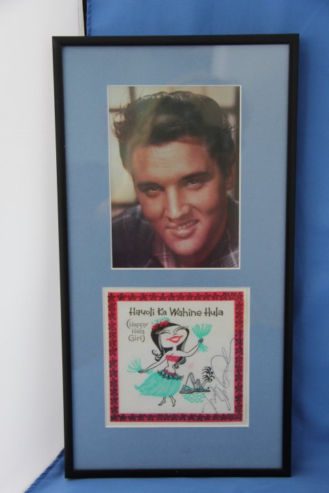 Elvis Presley Autograph and Photo: Framed Elvis Presley autographed napkin and photo. Measures 7 x 14 framed.