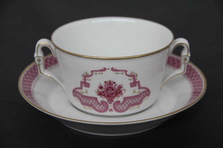 Heinrich Germany Bouillon Cup: Heinrich Germany porcelain bouillon cup. White with gold, pink and red decoration. Saucer measures 6 1/2 inches diameter and cup measures 4 inches diameter.
