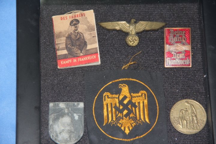 Nazi Shoulder Patches: 61-6743 One Nazi shoulder patch, 2 propaganda tinnies, 1 German hat pin, 1 mini book.