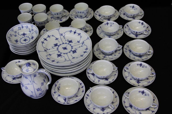 Royal Copenhagen Blue Fluted Plain Dinnerware Set 52: 99-6899 Royal Copenhagen Blue Fluted Plain dinnerware. 7 dinner plates, (one is chipped,) 10 in. 8 dinner bowls, 6 in. 6 bouillon cups and saucers. 6 coffee cups and saucers. 4 teacups and saucers. 4