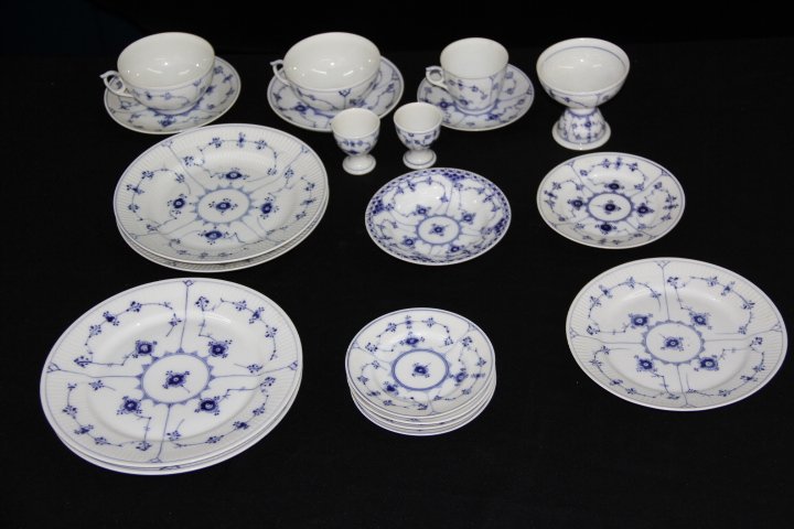 Royal Copenhagen Blue Fluted Plain Misc. 20 Pieces: 101-6901 Royal Copenhagen Blue Fluted Plain misc. pieces. 2 coffee cups and saucers - 4 in. 1 teacup and saucer. 2 egg cups. 1 Footed desert cup-3.5 in. 2 plates - 8 in. 1 small bowl- 5.5 in. 1 small 