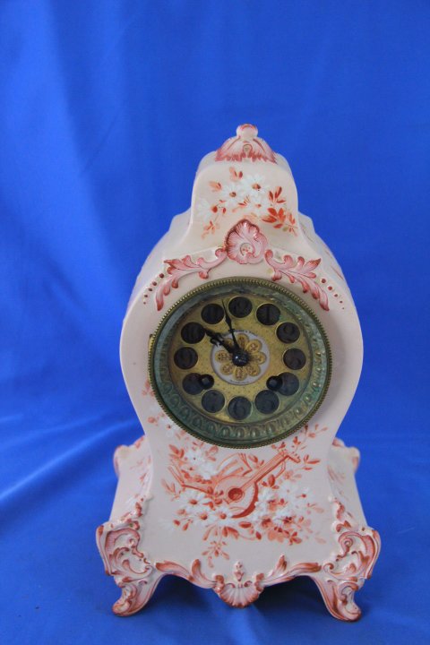 Bailey, Banks & Biddle Porcelain Clock: 169-856 Bailey Banks and Biddle porcelain clock. Marked Philadelphia on the dial. 1980. 11 1/2 in. tall x 7 in. Key.