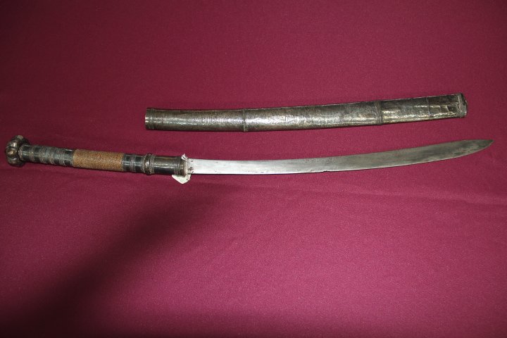 Curved Blade with Elongated Point 19 1/2 in.: 203-886 Curved blade with elongated point. 19 1/2 in. The hilt and scabbard overlaid in sheet silver. Rattan grip.