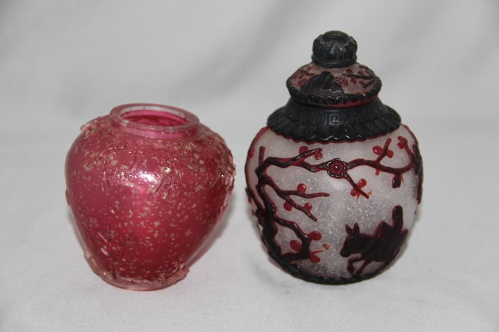 Peking Glass Overlay Snuff Bottles - 2: 109-3329-1394 Rose colored Peking glass snuff bottle. Missing the top. The other is white with a red background.