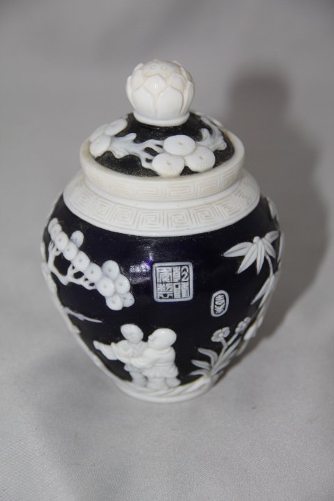 Peking Glass with Lid: 113-1396 Peking glass with lid. Cobalt with white overlay. Trees and people. Marked.