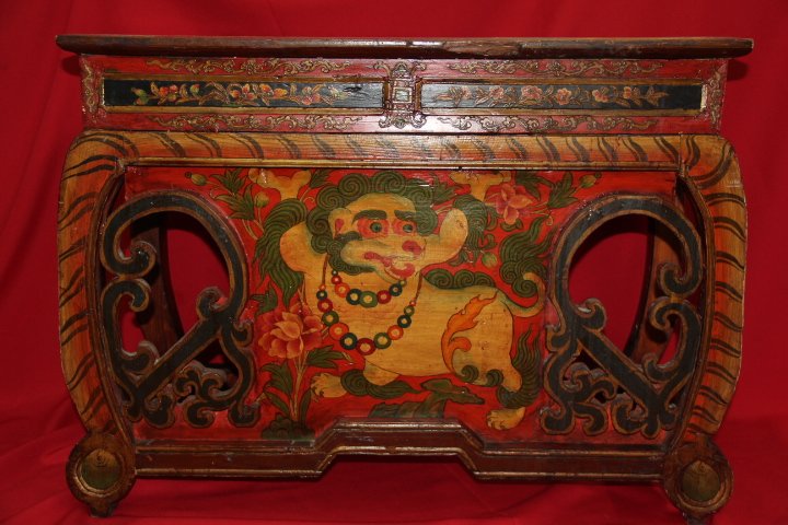 Tibetan Antique Prayer Table: 197-1637 19th Century Tibetan antique prayer table. Highly carved with a lion and lion feet. Painted in rich vivid colors. Measures 32 1/2 x 23 3/4 in.