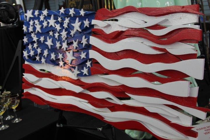 Hand Made Folk Art American Flag: 8-7945 Hand made folk art American flag. Wood construction. Measures 44 x 23 in.