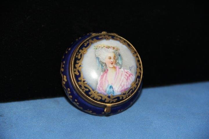 Sevres Porcelain "Patch" Box: 17-7951 Sevres hand painted porcelain hinged patch box. When ladies wore facial or beauty patches, they were kept in porcelain boxes. Portrait of a lady on the lid and hand painted floral interior. 2 