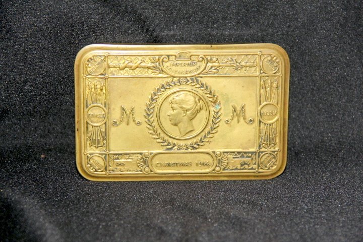 Imperium Brittannicum Christmas 1914 Tin: 12-1452 Imperium Brittannicum Christmas 1914 tin. Gift given to members of the British Colonial and Indian Armed Forces for Christmas 1914 by Princess Mary. Tin was filled with tobacco, confectionary,