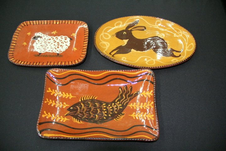 Three Redware Trays: 25-1700-1783-1736 Three Redware trays marked Cazan. Sheep, 2004, measures 10 x 7 in. Rabbit, 2006, measures 13 x 8 1/2 in. Fish, 2002, measures 12 x 7 1/2 in.