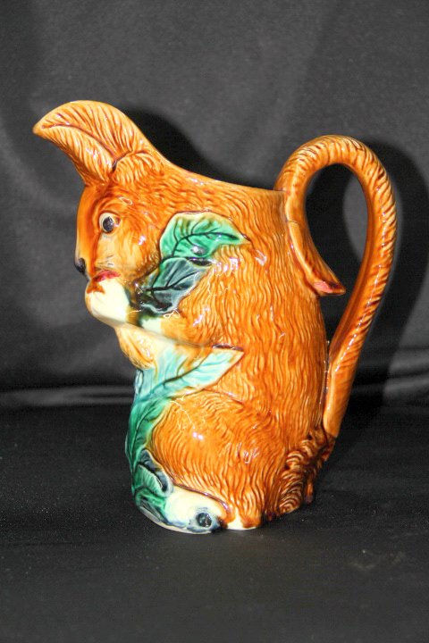 Squirrel Pitcher Possibly Majolica: 50-1437 Squirrel pitcher. Possibly Majolica. Measures 9 in tall. Marked on the bottom A E b 3. Has 4 in crack on left side.