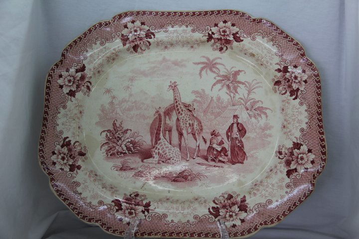 Red and White Ironstone Platter Dated 1830: 59-1853 Red and white ironstone platter with giraffes. Dated on the back, Aug. 30th, 1830. Measures 17 x 14 in. Stained on both sides from use. Signed Gjraffe.