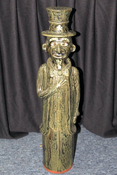 Folk Art Pottery Uncle Sam Statue: 74-1851 Folk art pottery statue of Uncle Sam, by Brian J. Wilson. Dated 08-15-2K2 on the bottom. Measures 24 in. high x 6 in.