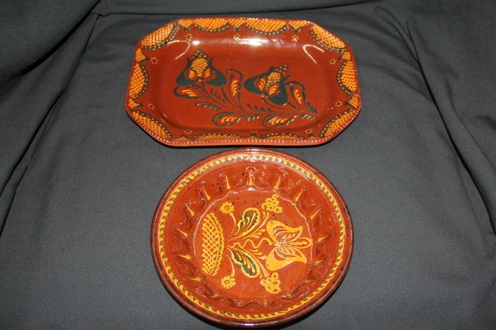 Two Redware Pieces: 77-1735-1739 Two Redware pieces. Round pie plate, measures 9 in. diameter, dated 2001. Rectangular tray, measures 9 1/2 x 13 in, dated 2000, signed by Ned Deitz.