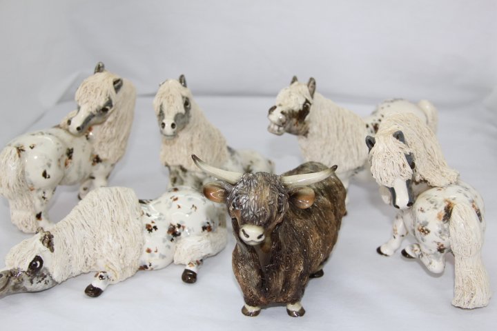 Group of Cheval Horse Figurines: 133- Apaloosa Pot Belly House Figurines made by Cheval. Handcrafted, unique items. 1. Timid Tammy - w/chipped ear. 2. Dreamy Daisy. 3. Bashful Betsy. 4. Footloose Freddy. 5. Joyful Jake. 6. Long horn 