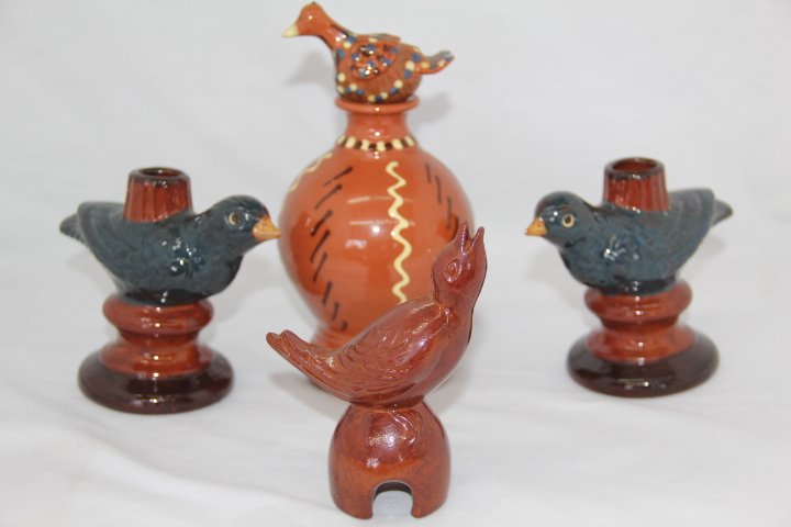 Group of Redware Birds: 181-1721 Group of Redware Pottery birds. Four birds. Large bird ia Nolde Forest Pottery Bird on pot, 2002, artist signed, #4, Village of Angelica, it is a bank, measures 7 x 4 in. Nolde Forest Pottery