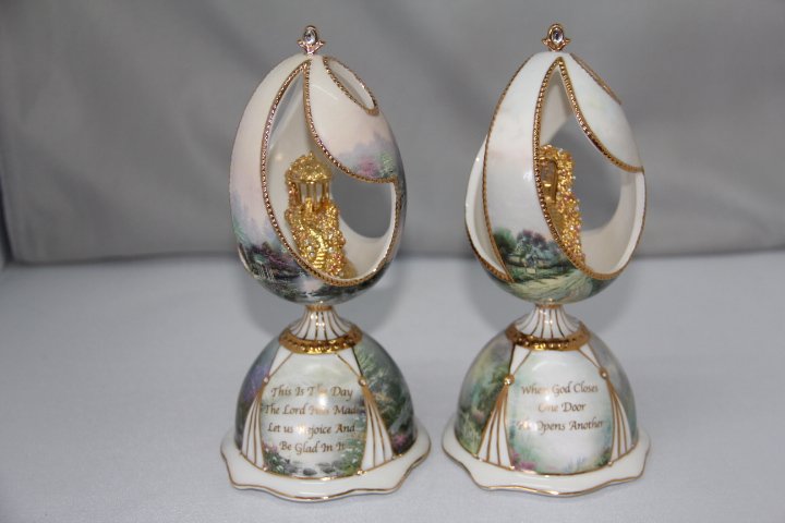 Pair of Thomas Kincade Musical Porcelain Eggs: 12-2104-2105 Blessings Of Hope and Blessings of Joy, Thomas Kincade musical porcelain eggs. Each measures 7 1/2 in. tall.