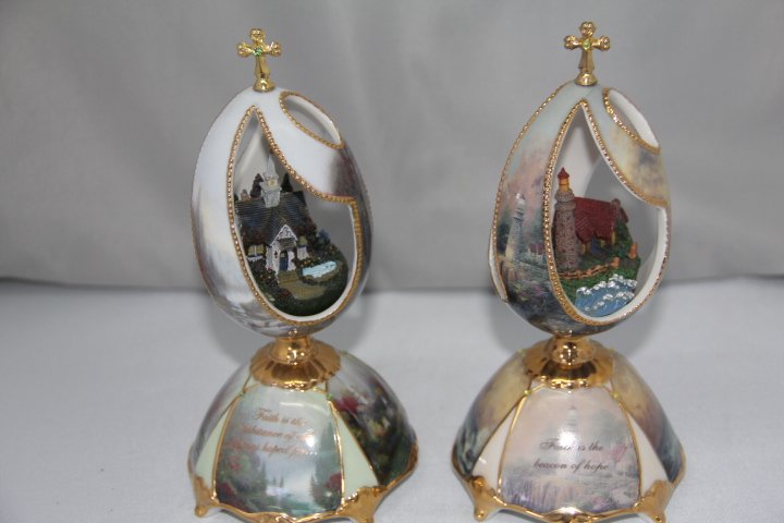 Pair of Thomas Kincade Musical Porcelain Eggs: 65-2017-2111 Thomas Kincade Porcelain Musical Eggs. Measures 7 in. tall each.
