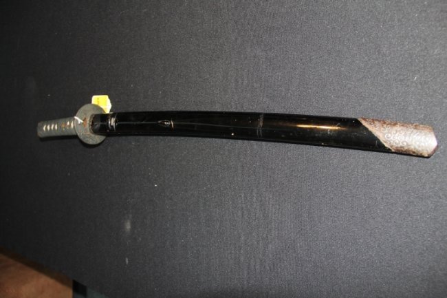 Sword - Japanese Wakizashi: 126-6218 Sword - Japanese Wakizashi 31 in. long. Weapon is in very good condition with pitting and chipping noted on blade. Unusual due to the scabbard having exquisite ornamental tip. All sword fitti