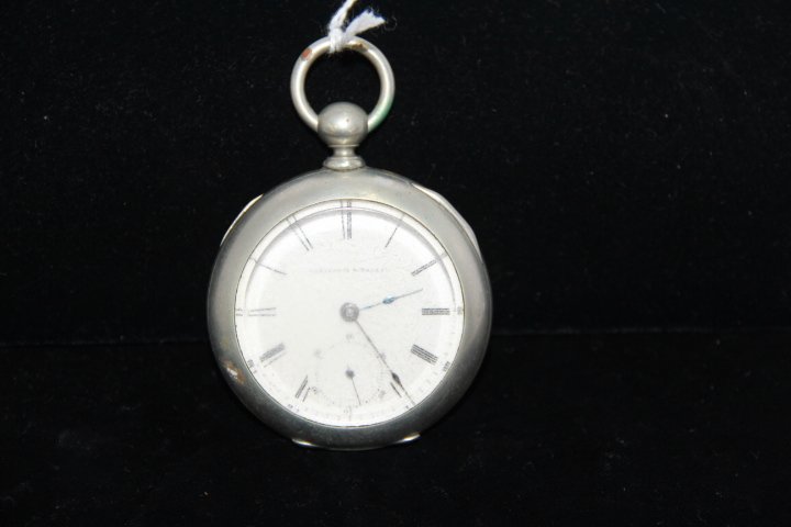 Antique Elgin Key Wind Pocket Watch: 176-4425 1900's Elgin pocket watch, nickel silver, key wind, no chain or key. Measures 2.25" diam. Watch #1016686. Watch has spot on back. DUEBER SILVERTINE. Watch face has scratches.