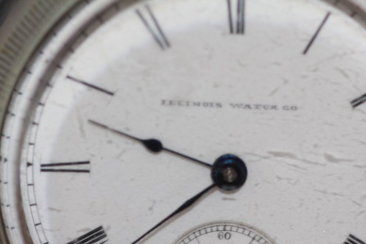 Antique Illinois Company Key Wind Pocket Watch: 179-4429 1869 Illinois Watch Company pocket watch, nickel silver, 17 jewels, no key or chain. Measures 2.25" diam. Watch has rust on stem and rust spots on back of case. DUEBER SILVERTINE.