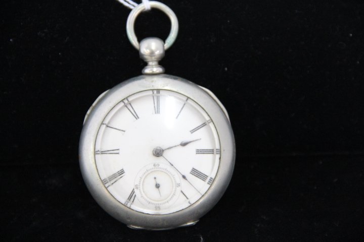 Antique Illinois Company Key Wind Pocket Watch: 181-4430 1876 Illinois Watch Company pocket watch, Springfield, Ill. Key wind, nickel silver. No key or chain. Watch #346151. Measures 2.25" diam. Watch case has dent in back. DUEBER SILVERTINE.