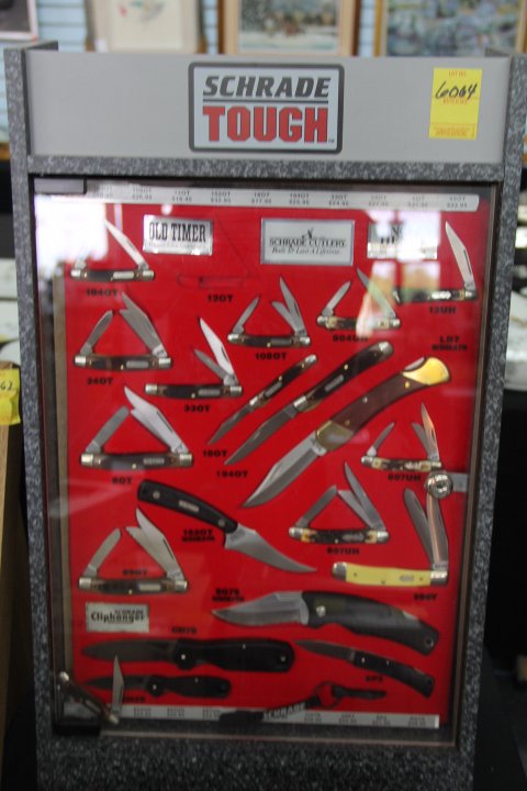 Schrade Cutlery Assorted Knives and Display Case, 1969: 196-6064 Assorted Schrade cutlery in display case, 12 Old Timer, 4 Uncle Henry, 2 Cliffhanger, 1 Lockblade, 3 misc. Original box and sheath. Case measures 26x15.5x9.