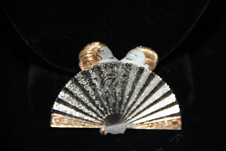 ErtÃ© "Love's Screen" Brooch: 213-4449 ErtÃ© brooch of gold, silver, seed pearls, and mother-of-pearl.Singed Erte, CFA, Sterling and 14k. "Love's Screen" closely follows one of ErtÃ©'s most charming drawings from the pages of