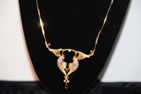 Erté "Phoenix" Necklace: 216-4452 Erté necklace of gold, diamonds, and rubies. St. I, #6 of 500, CFA 14K, "Phoenix" brings together birds, mythology, and love. Here two birds are made eternal through their love.