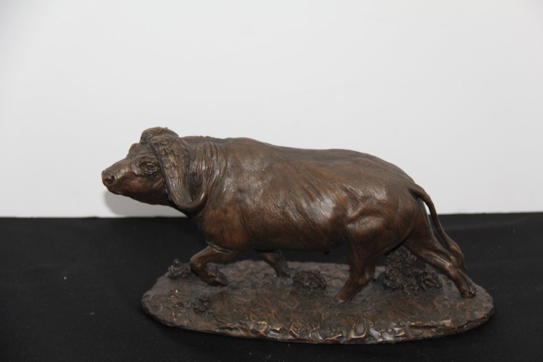 Robert Glen Bronze Sculpture: 250-4611 Bronze sculpture "Charge on the Serengeti" by Robert Glen. An official issue of the East African Wildlife Society. 11l x 5h x 4w.