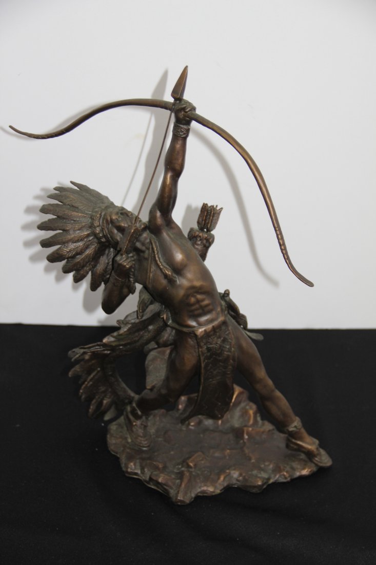 Lincoln Fox Bronze Sculpture: 252-4614 Bronze Native American Indian with headress with bow and arrows by 1988 Lincon Fox, 1988. 15.5t x 10l x 6w.