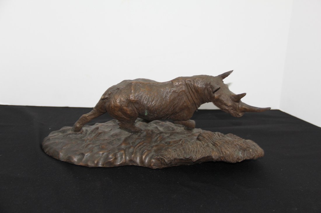 Robert Glen Bronze Sculpture: 253-4741 Bronze "Thunder of the Congo" by Robert Glen. An official issue of the East African Wildlife Socite. 16l x 6.55t x 6w.