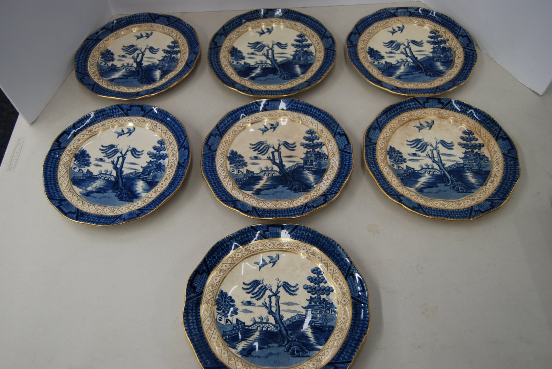 Seven Booths "Real Old Willow" 9-inch plates: 146-5193; Seven Booths "Real Old Willow" 9-inch plates; Made in England; Sold by The Bailey, Banks, and Biddle in Philadelphia; gold trim; blue oriental landscape