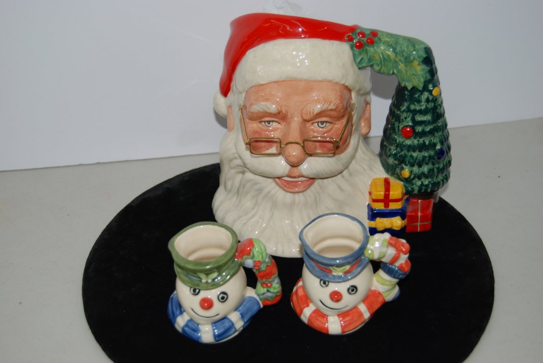 Three Royal Doulton Character Jugs - Santa Claus Jug: 212-5275 Three Character Jugs - Royal Doulton Santa Claus Jug measures 7" tall, Modelled by David B Biggs, # 1013 of 2500, marked "D7123", made in 1998; "Christmas Stocking Snowman" Jug measures 2.75"