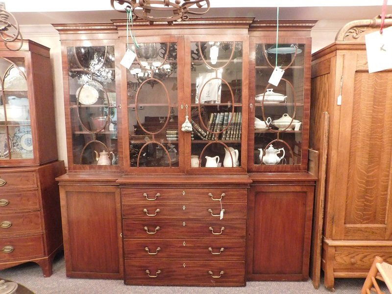 Mahogany Breakfront: Mahogany breakfront with pencil inlay and mother of pearl key escusions. Measures 88 in. tall 87 in. long and 21 in. deep.