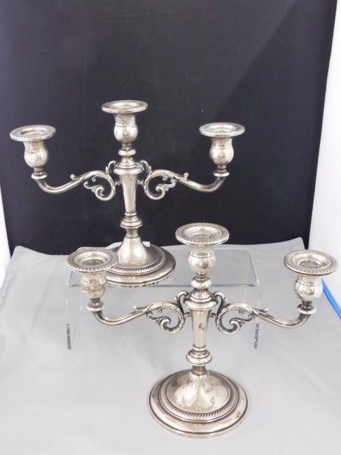 Pair of Sterling Silver Candelabra: Pair of Fisher weighted 9 sterling silver candelabra. Measures 9 inches tall and 11 inches wide.