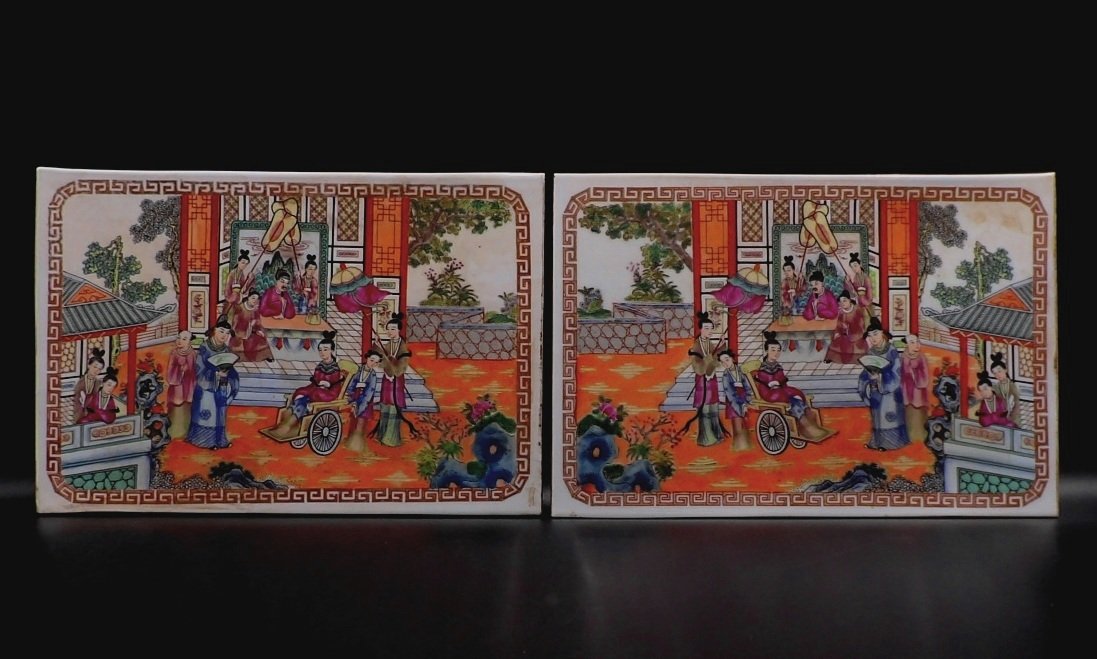 A pair of Chinese Porcelain Plaques: Chinese Famille Rose plaques, colorful scene of men and women together in a garden landscape. H 10" W 14 1/2"