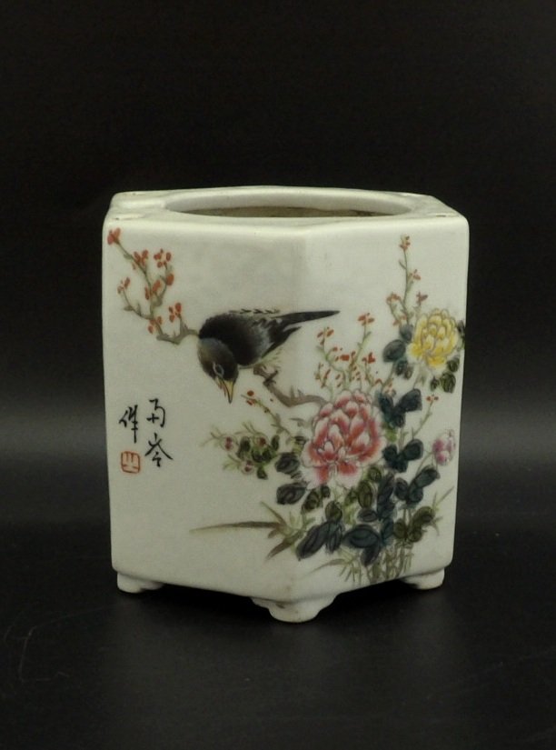 Chinese hexagon Famille Rose Brush Pot: A hexagon Famille Rose brush pot on feet. The panels are painted with scenes of bird and followers, decorated with calligraphy and mark. H 4” W 4"