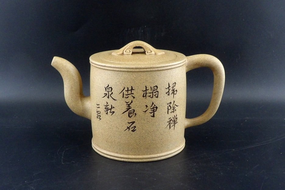 Chinese Yixing Zisha Teapot Poem: Chinese zisha teapot, the cylinder shaped body incised Chinese calligraphy poem, marks on bottom. H 4” W 6 1/2"