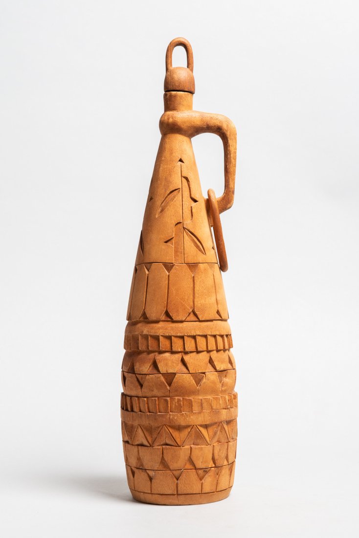 Drinking Vessel: Drinking vessel with handle. Suriname. Wood. H: 19.75". Shipping costs noted below are estimates for USA locations via FEDEX ground. Actual costs may vary.