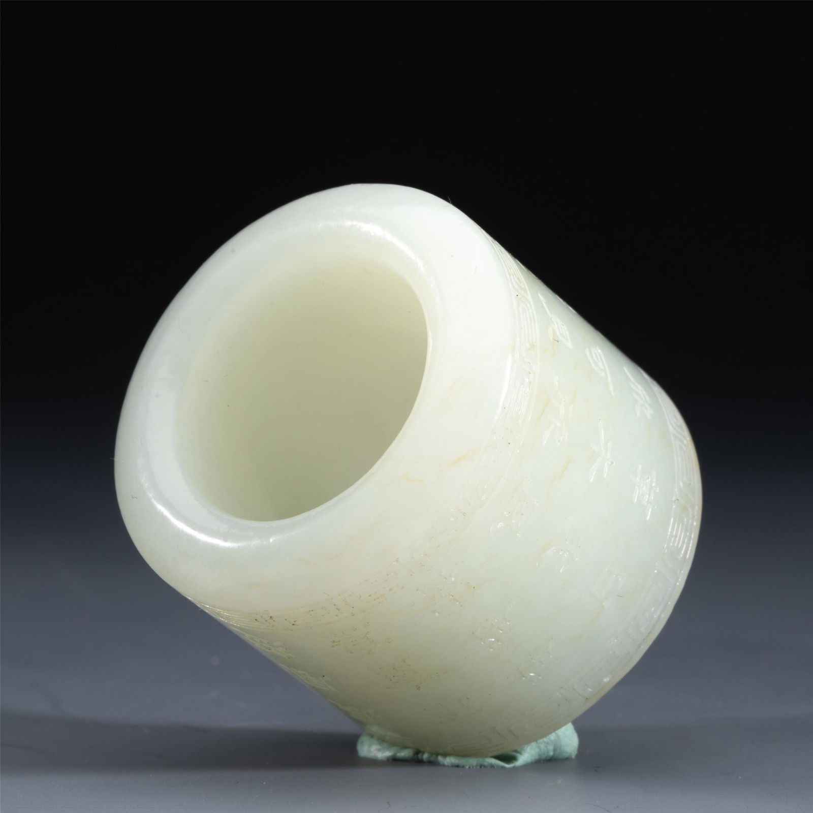 A CHINESE INSCRIBED JADE ARCHER RING (1 of 8)