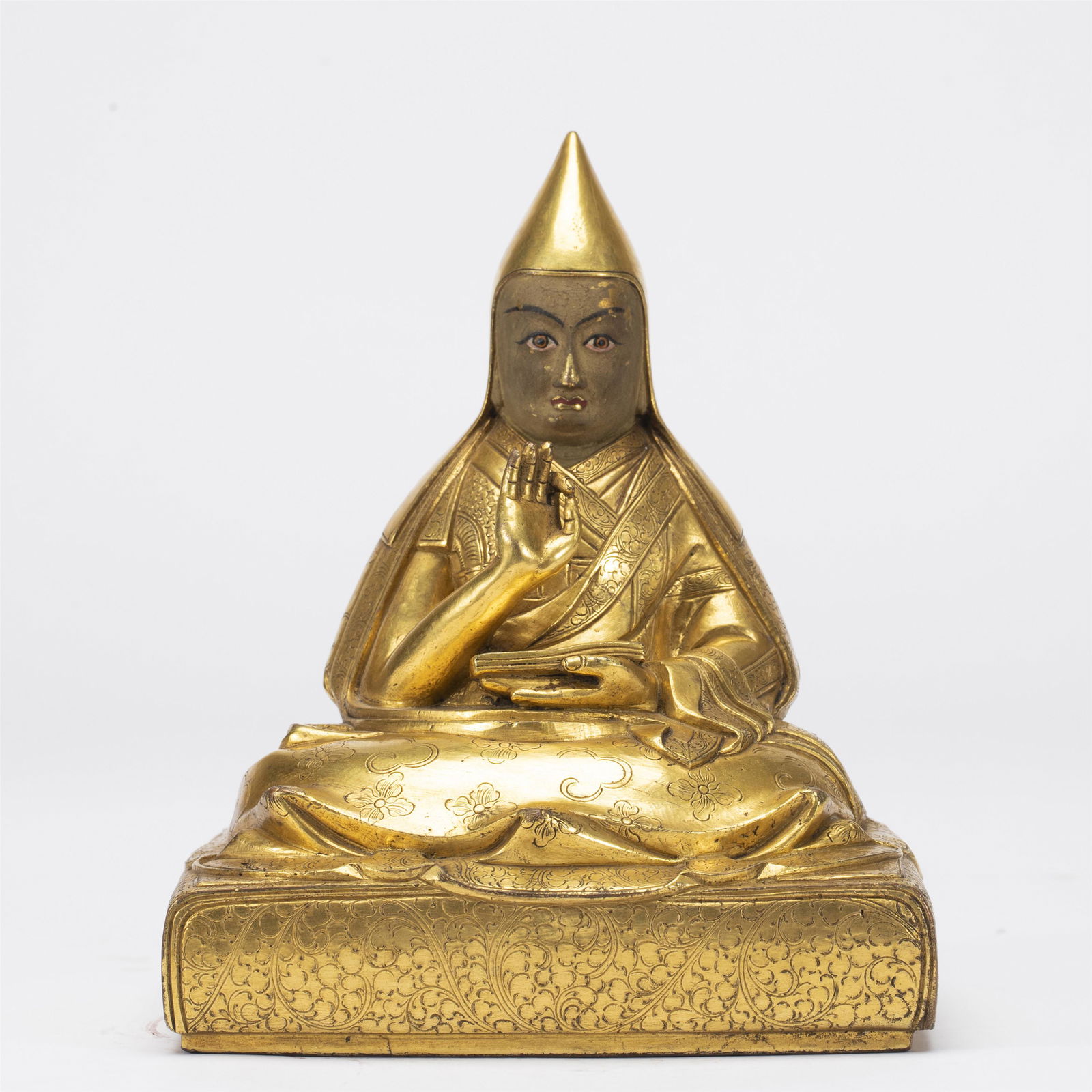 A TIBETAN BRONZE-GILT FIGURE OF LAMA (1 of 9)