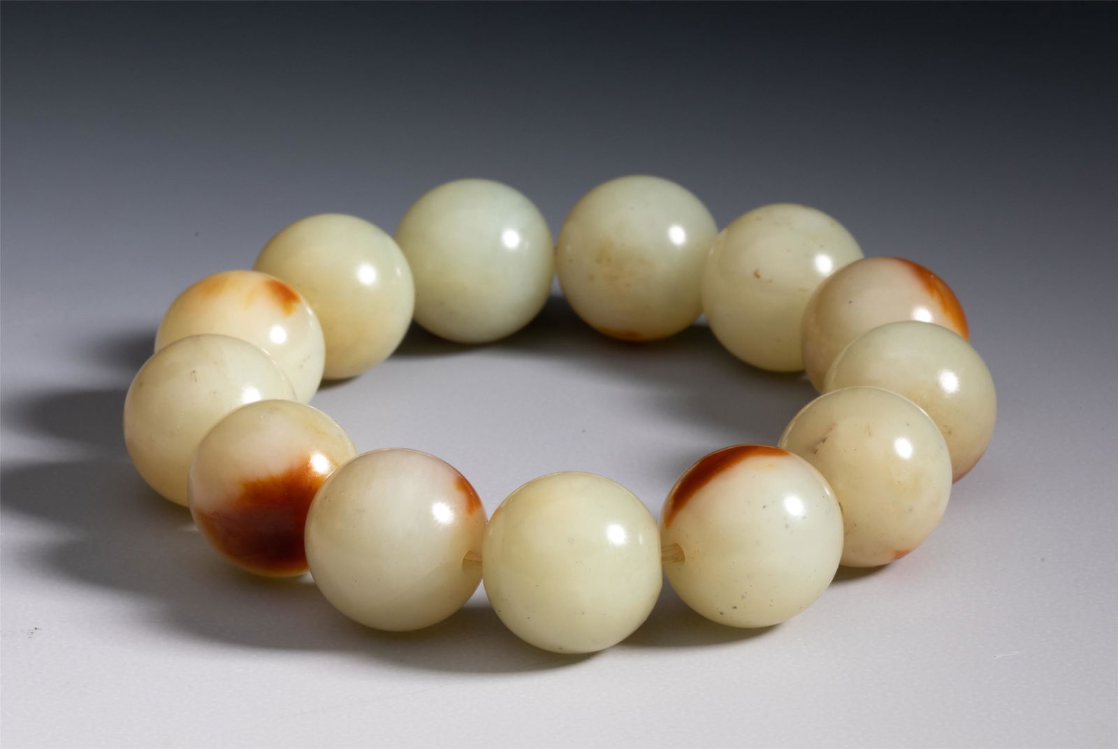 A CHINESE CARVED JADE PRAYER BEADS (1 of 9)