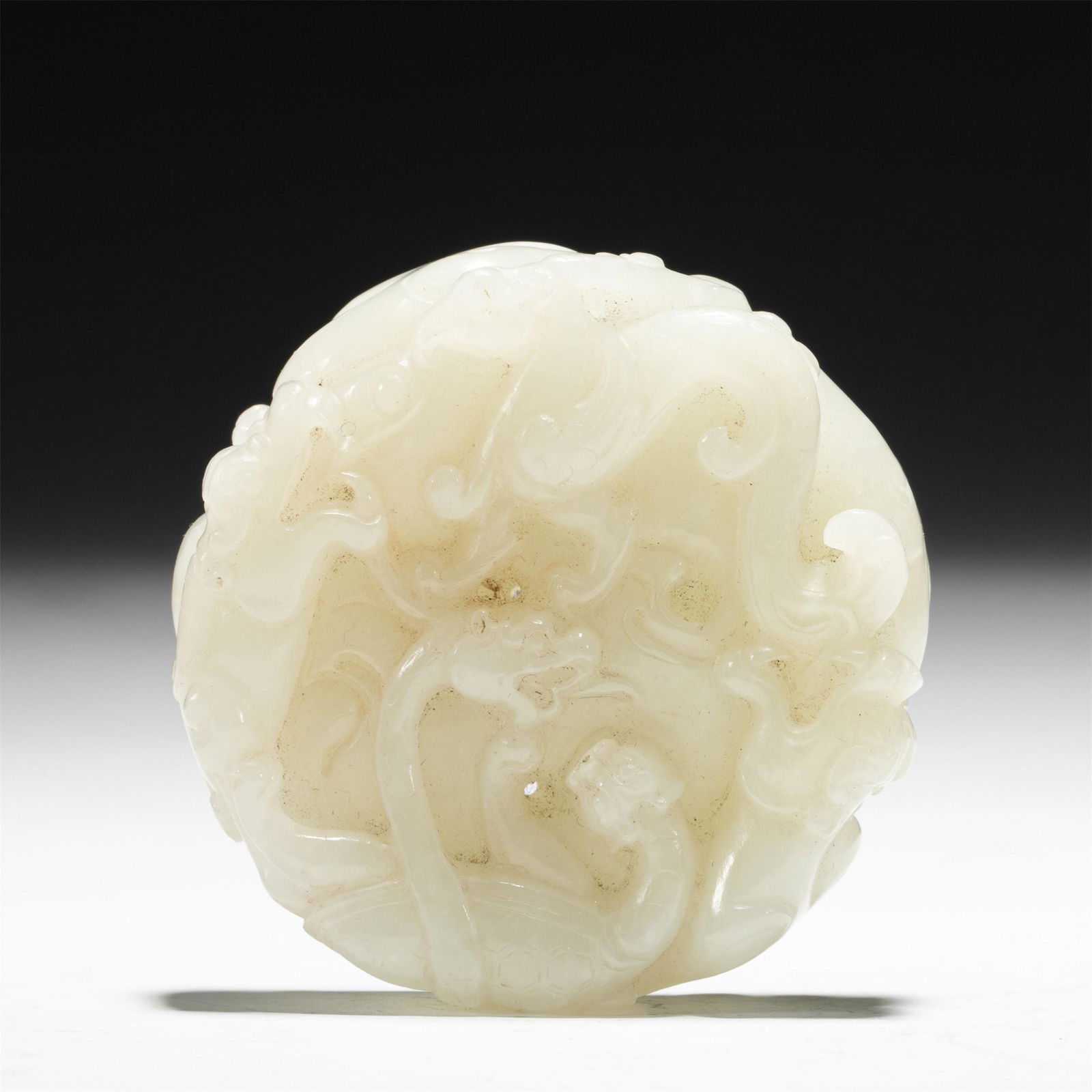 A CARVED JADE CIRCULAR PENDANT (1 of 6)