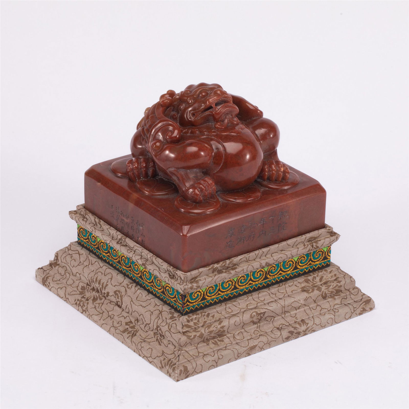 A CHINESE INSCRIBED SOAPSTONE BEAST SEAL (1 of 10)