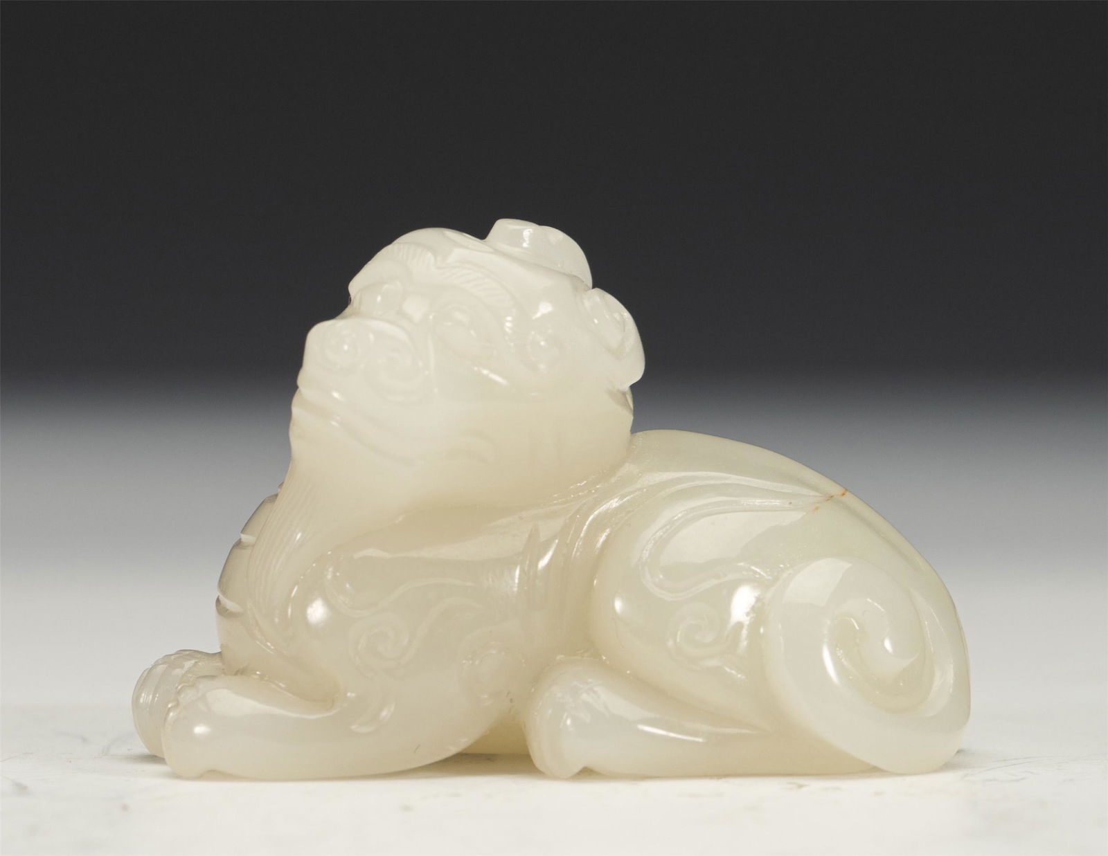 A CHINESE CARVED JADE MYTHICAL BEAST (1 of 8)