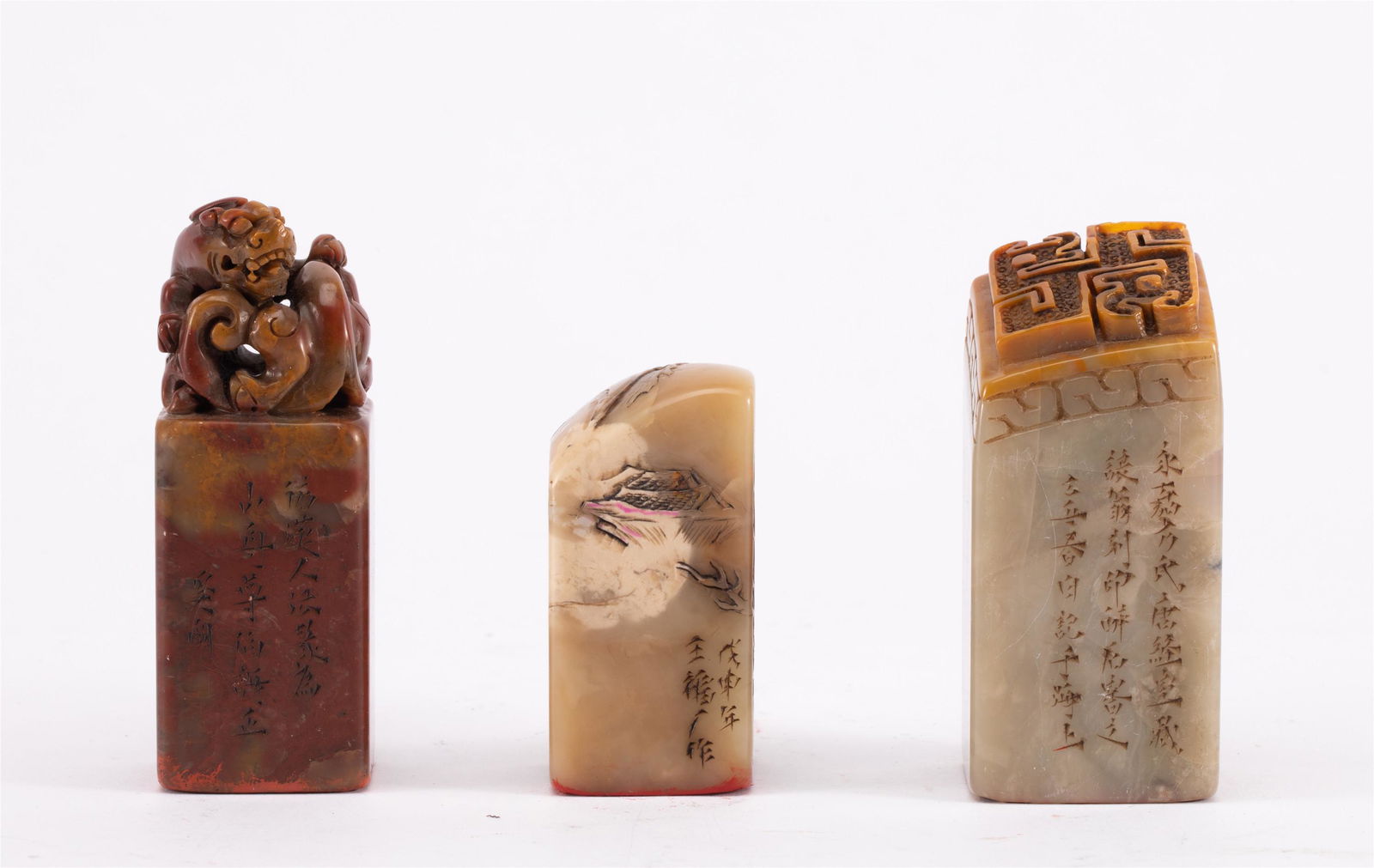 THREE CHINESE INSCRIBED SOAPSTONE SEALS (1 of 10)
