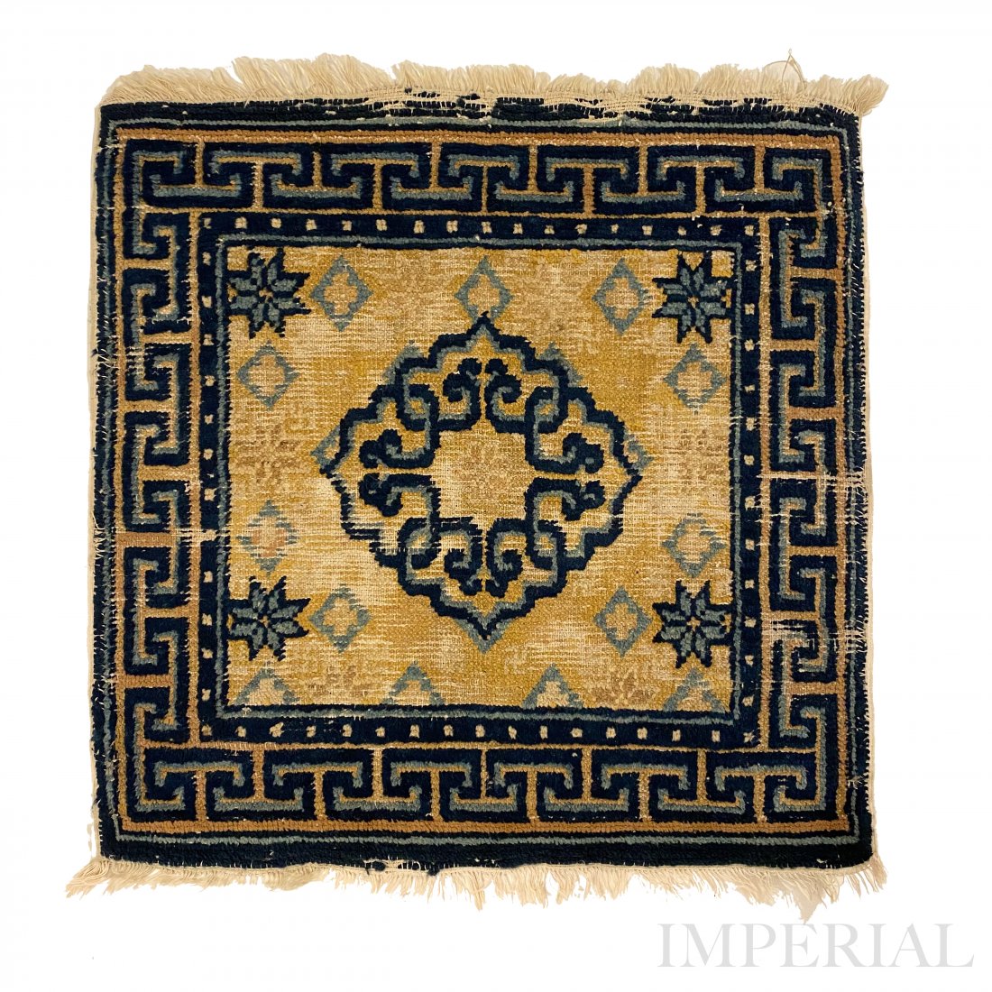 A NINGXIA MAT, CHINA, 18th CENTURY: A NINGXIA SQUARE SITTING RUG, China, late 18th Century. Decorated with a central medallion on yellow ground, bordered by cauldrons. With signs of wear. 62.5cm x 64cm.