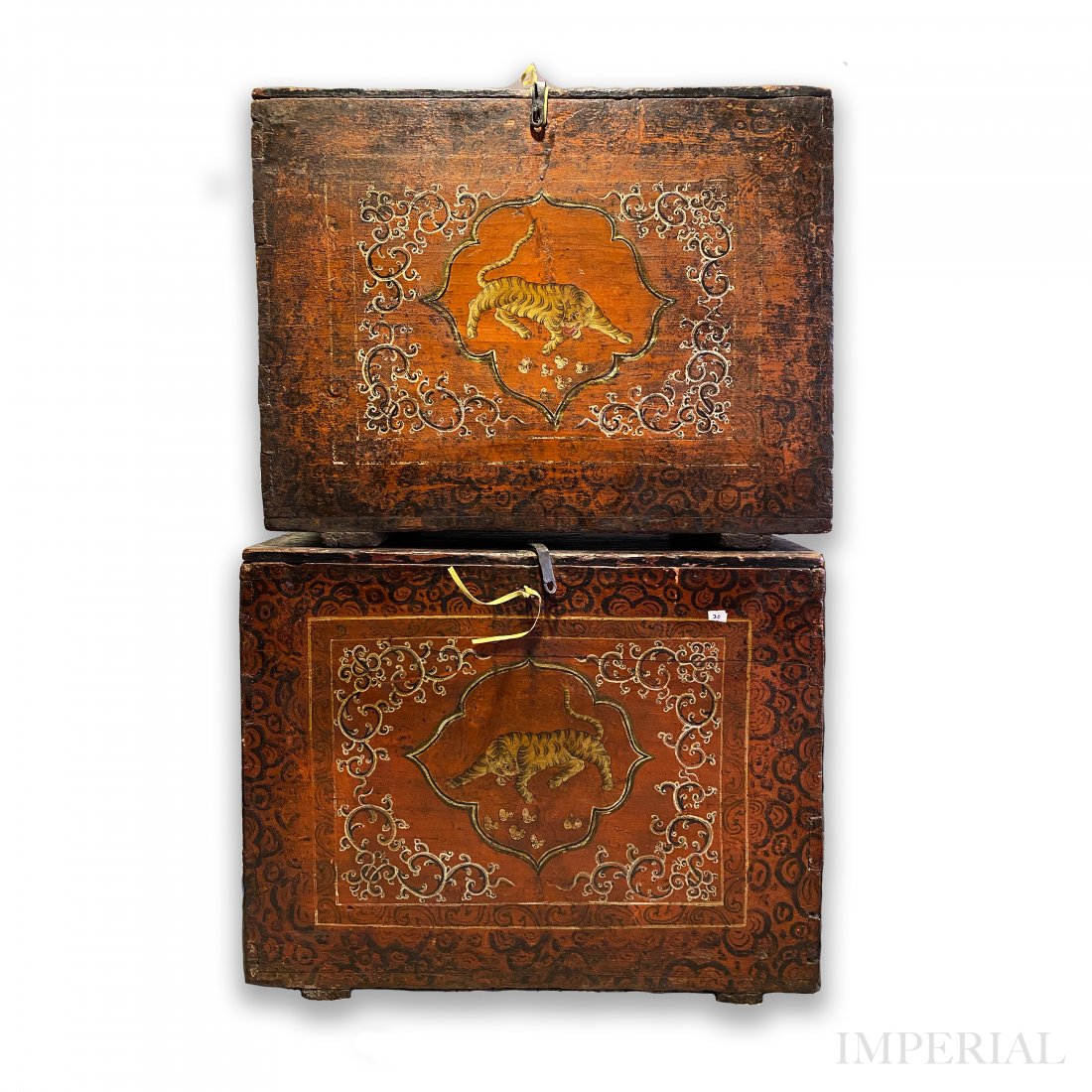 A RARE PAIR OF TIGER CHESTS, TIBET, 18th CENTURY: A RARE PAIR OF POLYCHROMED TIGER CHESTS, TIBET, 18th CENTURY or earlier. The chests are painted on orange field. The front rectangular panels depict masterfully drawn tigers within the central cartouc